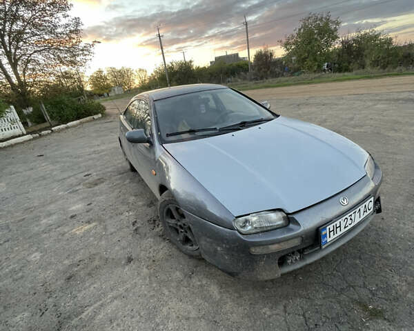 Серый Мазда 323, объемом двигателя 2 л и пробегом 280 тыс. км за 2500 $, фото 4 на Automoto.ua