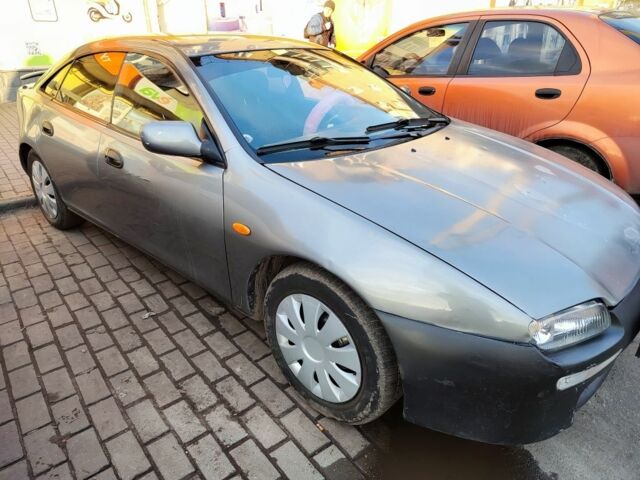 Сірий Мазда 323, об'ємом двигуна 1.5 л та пробігом 293 тис. км за 3000 $, фото 2 на Automoto.ua