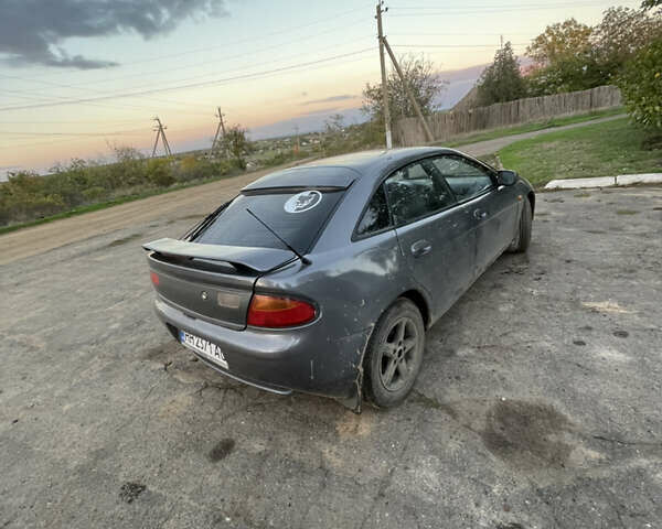 Серый Мазда 323, объемом двигателя 2 л и пробегом 280 тыс. км за 2500 $, фото 3 на Automoto.ua