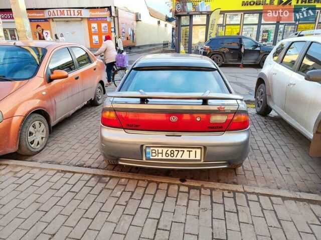 Сірий Мазда 323, об'ємом двигуна 1.6 л та пробігом 293 тис. км за 3000 $, фото 2 на Automoto.ua