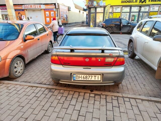Сірий Мазда 323, об'ємом двигуна 1.5 л та пробігом 293 тис. км за 3000 $, фото 3 на Automoto.ua