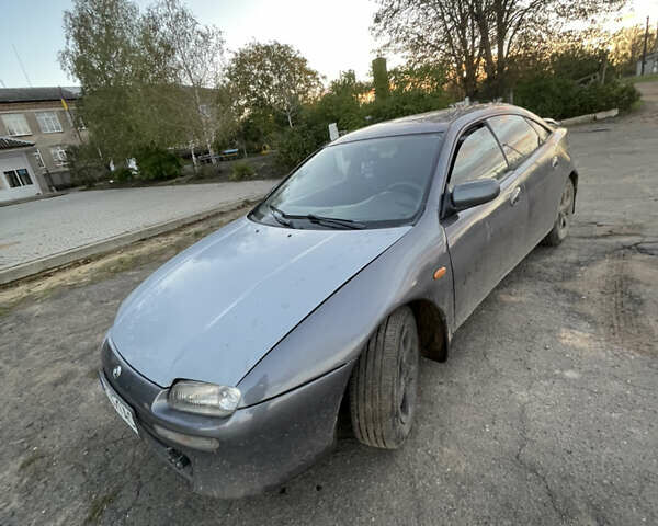 Серый Мазда 323, объемом двигателя 2 л и пробегом 280 тыс. км за 2500 $, фото 5 на Automoto.ua
