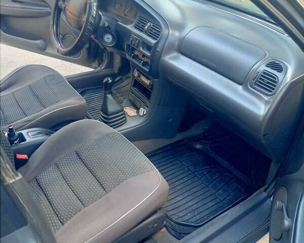 Серый Мазда 323, объемом двигателя 1.49 л и пробегом 300 тыс. км за 2600 $, фото 2 на Automoto.ua