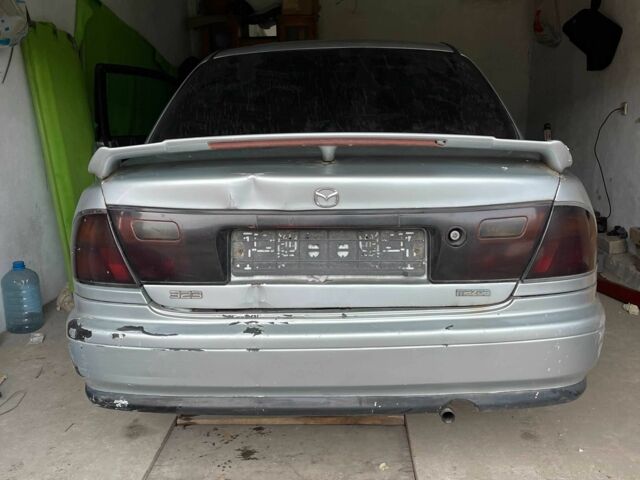 Серый Мазда 323, объемом двигателя 0 л и пробегом 150 тыс. км за 900 $, фото 5 на Automoto.ua