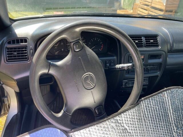 Серый Мазда 323, объемом двигателя 1.5 л и пробегом 137 тыс. км за 2800 $, фото 6 на Automoto.ua