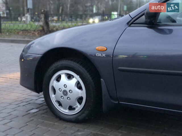 Серый Мазда 323, объемом двигателя 1.5 л и пробегом 199 тыс. км за 2000 $, фото 12 на Automoto.ua