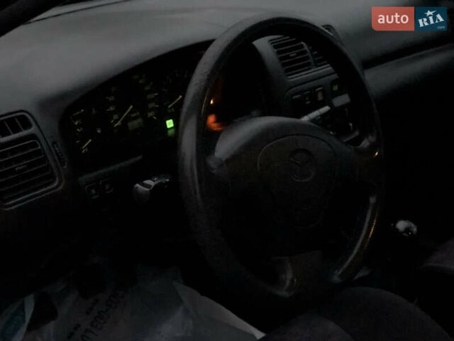 Серый Мазда 323, объемом двигателя 1.5 л и пробегом 199 тыс. км за 2000 $, фото 28 на Automoto.ua