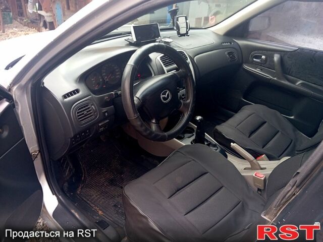 Сірий Мазда 323, об'ємом двигуна 1.8 л та пробігом 247 тис. км за 2200 $, фото 2 на Automoto.ua