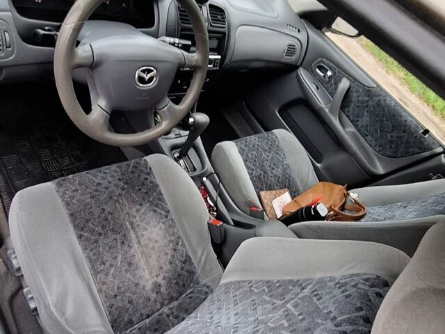 Серый Мазда 323, объемом двигателя 0 л и пробегом 170 тыс. км за 2200 $, фото 7 на Automoto.ua