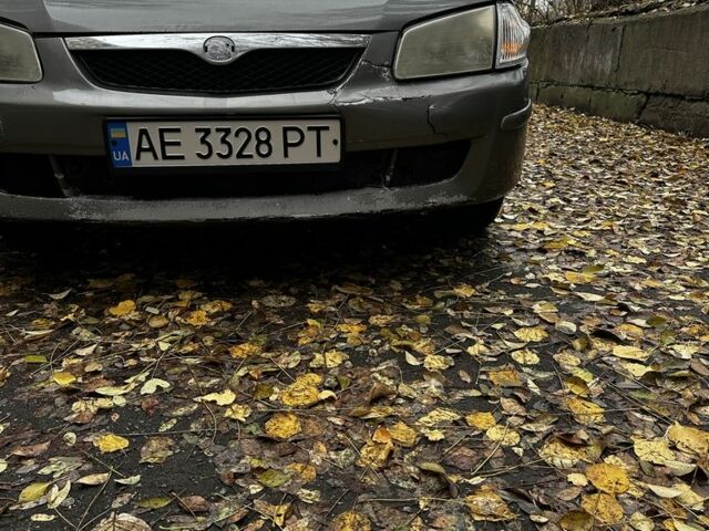 Серый Мазда 323, объемом двигателя 1.5 л и пробегом 315 тыс. км за 1300 $, фото 12 на Automoto.ua