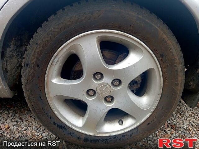 Сірий Мазда 323, об'ємом двигуна 1.8 л та пробігом 247 тис. км за 2200 $, фото 12 на Automoto.ua