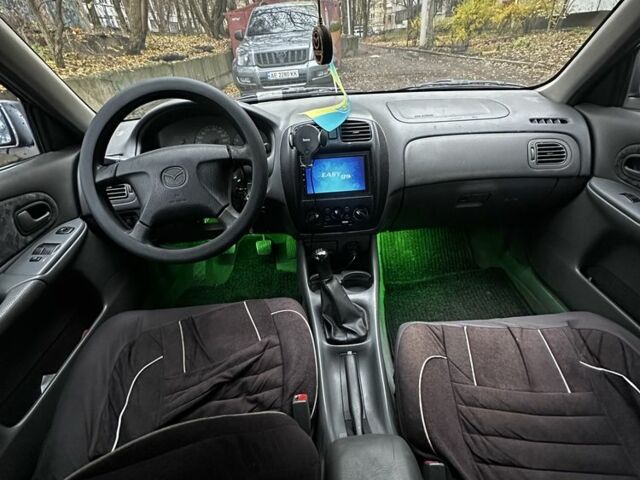 Серый Мазда 323, объемом двигателя 1.5 л и пробегом 315 тыс. км за 1300 $, фото 14 на Automoto.ua