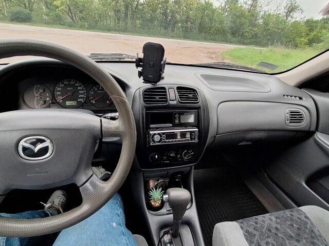 Серый Мазда 323, объемом двигателя 0 л и пробегом 170 тыс. км за 2200 $, фото 5 на Automoto.ua