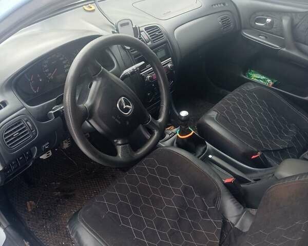 Серый Мазда 323, объемом двигателя 1.5 л и пробегом 315 тыс. км за 2800 $, фото 4 на Automoto.ua