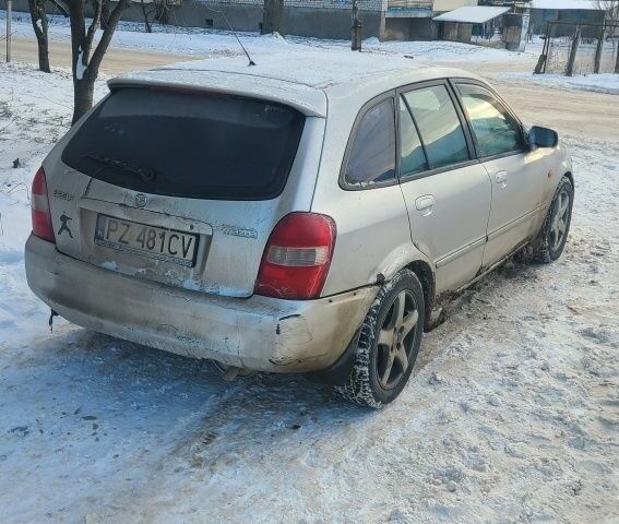 Серый Мазда 323, объемом двигателя 2 л и пробегом 300 тыс. км за 950 $, фото 3 на Automoto.ua