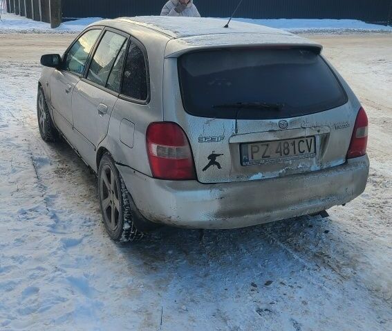 Серый Мазда 323, объемом двигателя 2 л и пробегом 300 тыс. км за 950 $, фото 2 на Automoto.ua