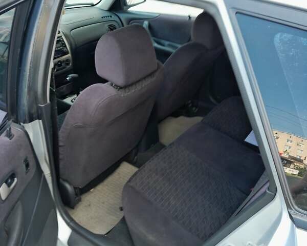 Серый Мазда 323, объемом двигателя 2 л и пробегом 258 тыс. км за 2800 $, фото 12 на Automoto.ua