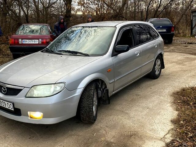 Серый Мазда 323, объемом двигателя 2 л и пробегом 200 тыс. км за 1900 $, фото 1 на Automoto.ua