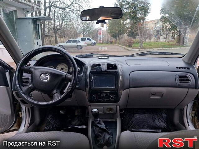 Серый Мазда 323, объемом двигателя 1.6 л и пробегом 200 тыс. км за 1800 $, фото 7 на Automoto.ua