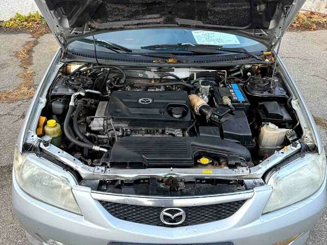 Серый Мазда 323, объемом двигателя 2 л и пробегом 200 тыс. км за 1900 $, фото 5 на Automoto.ua