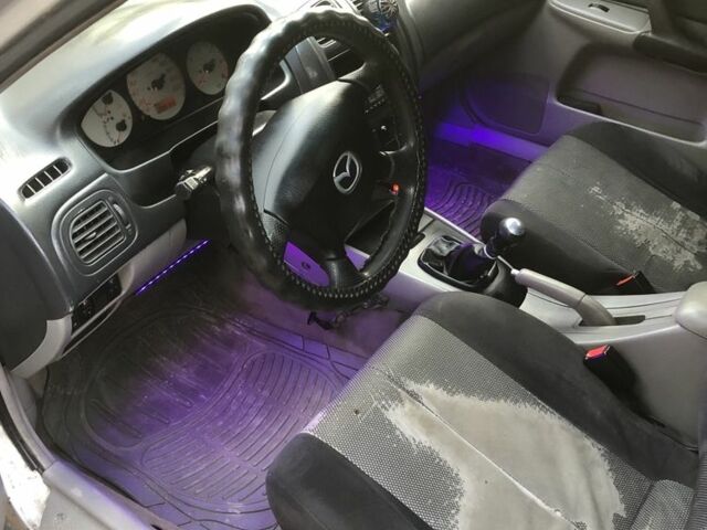 Серый Мазда 323, объемом двигателя 0 л и пробегом 358 тыс. км за 850 $, фото 5 на Automoto.ua