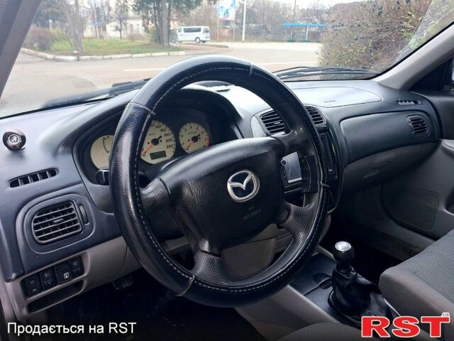 Сірий Мазда 323, об'ємом двигуна 1.6 л та пробігом 200 тис. км за 1800 $, фото 10 на Automoto.ua