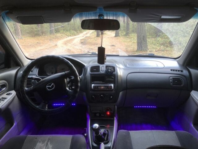 Серый Мазда 323, объемом двигателя 2 л и пробегом 358 тыс. км за 1200 $, фото 11 на Automoto.ua