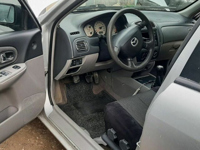 Серый Мазда 323, объемом двигателя 2 л и пробегом 230 тыс. км за 700 $, фото 6 на Automoto.ua