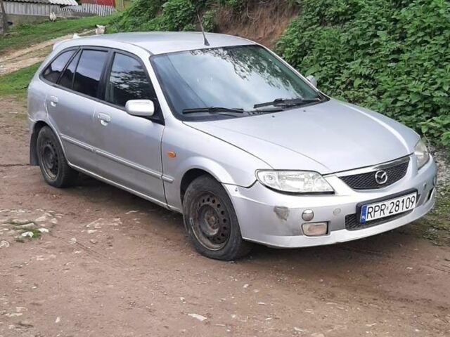 Серый Мазда 323, объемом двигателя 2 л и пробегом 230 тыс. км за 700 $, фото 1 на Automoto.ua