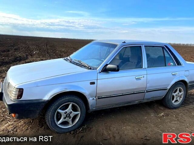 Серый Мазда 323, объемом двигателя 1.3 л и пробегом 123 тыс. км за 700 $, фото 3 на Automoto.ua
