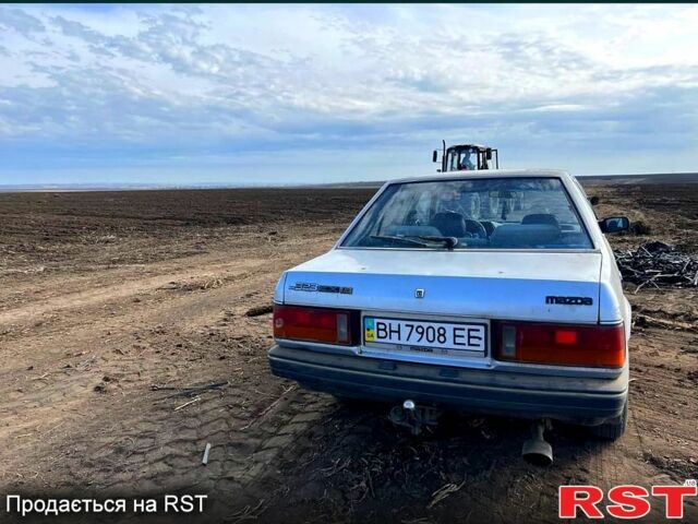 Серый Мазда 323, объемом двигателя 1.3 л и пробегом 123 тыс. км за 700 $, фото 2 на Automoto.ua