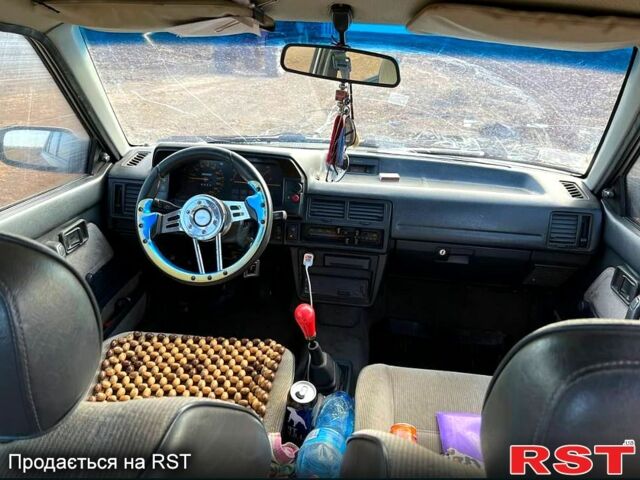 Серый Мазда 323, объемом двигателя 1.3 л и пробегом 123 тыс. км за 700 $, фото 1 на Automoto.ua