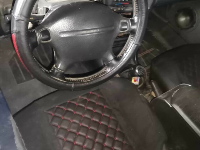 Серый Мазда 323, объемом двигателя 2 л и пробегом 200 тыс. км за 306 $, фото 3 на Automoto.ua