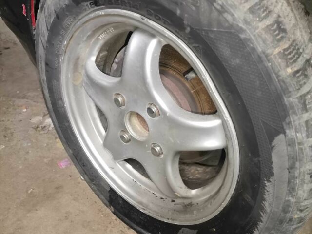 Серый Мазда 323, объемом двигателя 2 л и пробегом 200 тыс. км за 306 $, фото 1 на Automoto.ua