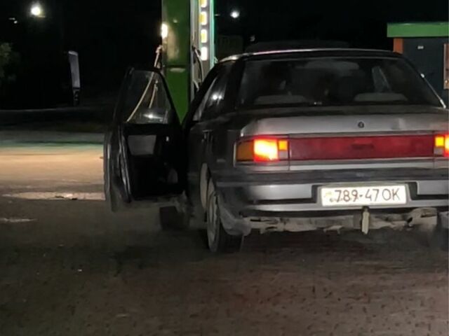 Серый Мазда 323, объемом двигателя 1.6 л и пробегом 550 тыс. км за 418 $, фото 4 на Automoto.ua