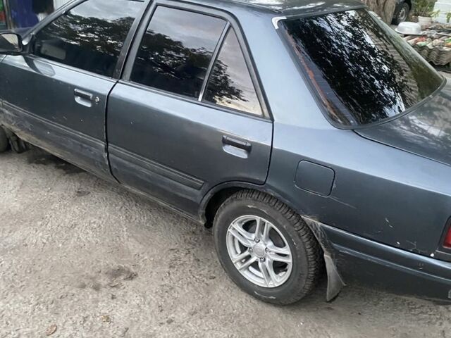 Серый Мазда 323, объемом двигателя 1.6 л и пробегом 150 тыс. км за 1500 $, фото 1 на Automoto.ua