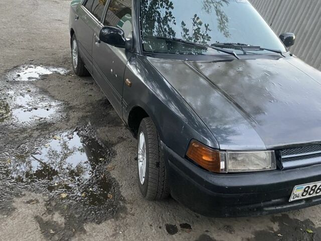 Серый Мазда 323, объемом двигателя 1.6 л и пробегом 150 тыс. км за 1500 $, фото 2 на Automoto.ua