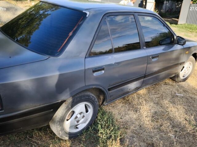 Серый Мазда 323, объемом двигателя 1.3 л и пробегом 260 тыс. км за 1600 $, фото 4 на Automoto.ua