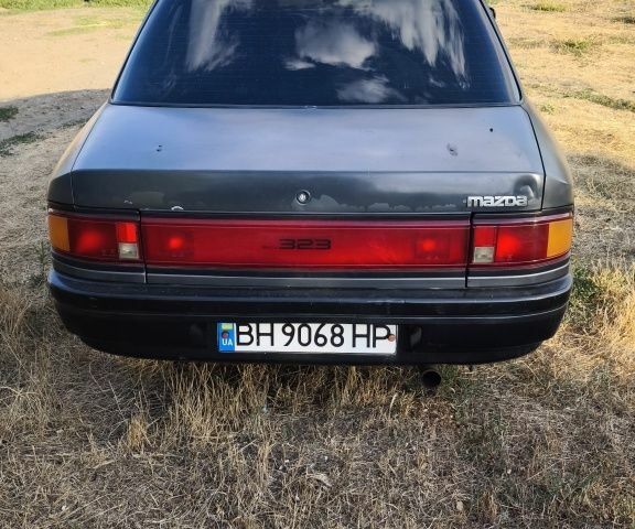 Серый Мазда 323, объемом двигателя 1.3 л и пробегом 260 тыс. км за 1600 $, фото 3 на Automoto.ua
