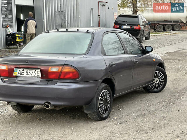 Серый Мазда 323, объемом двигателя 1.5 л и пробегом 320 тыс. км за 1700 $, фото 2 на Automoto.ua