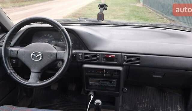 Сірий Мазда 323, об'ємом двигуна 1 л та пробігом 420 тис. км за 2700 $, фото 5 на Automoto.ua