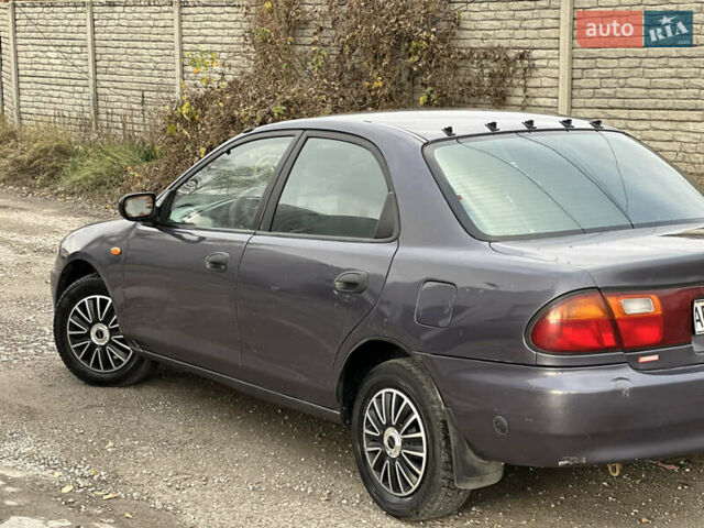 Серый Мазда 323, объемом двигателя 1.5 л и пробегом 320 тыс. км за 1700 $, фото 5 на Automoto.ua
