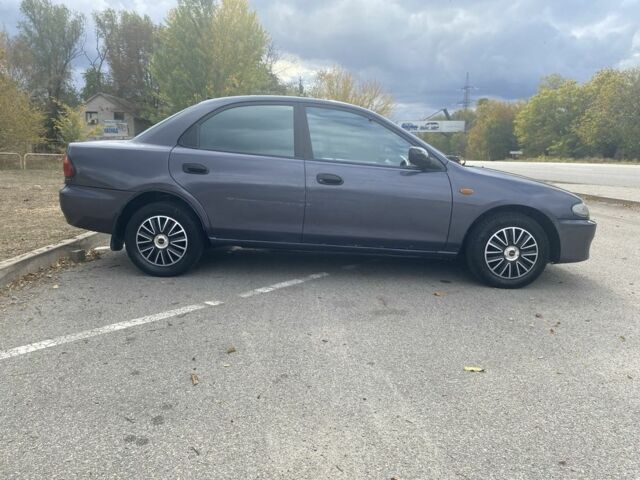 Серый Мазда 323, объемом двигателя 1.5 л и пробегом 370 тыс. км за 1699 $, фото 7 на Automoto.ua