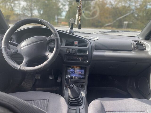 Серый Мазда 323, объемом двигателя 1.5 л и пробегом 370 тыс. км за 1699 $, фото 12 на Automoto.ua