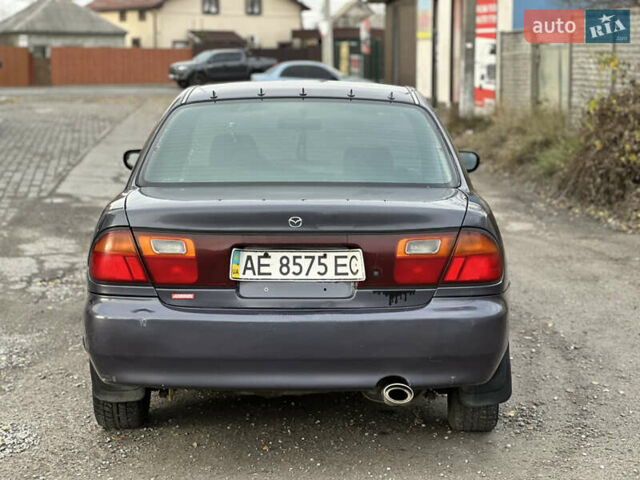 Серый Мазда 323, объемом двигателя 1.5 л и пробегом 320 тыс. км за 1700 $, фото 1 на Automoto.ua