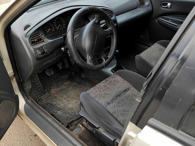 Серый Мазда 323, объемом двигателя 15 л и пробегом 270 тыс. км за 1000 $, фото 4 на Automoto.ua