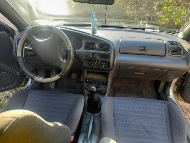 Серый Мазда 323, объемом двигателя 1.5 л и пробегом 2 тыс. км за 1000 $, фото 2 на Automoto.ua