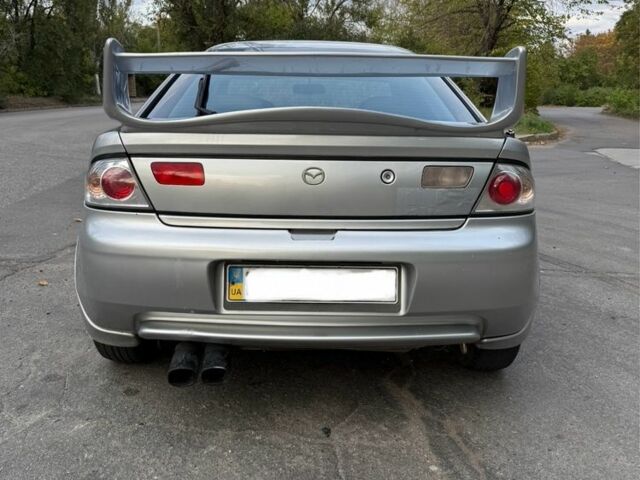 Серый Мазда 323, объемом двигателя 1.5 л и пробегом 335 тыс. км за 3300 $, фото 4 на Automoto.ua