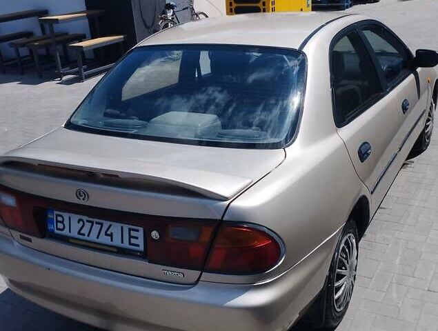 Серый Мазда 323, объемом двигателя 1.5 л и пробегом 390 тыс. км за 2600 $, фото 1 на Automoto.ua