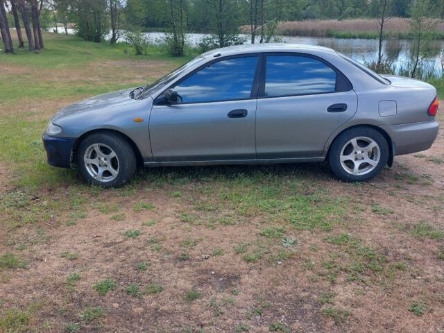 Сірий Мазда 323, об'ємом двигуна 1.5 л та пробігом 294 тис. км за 2000 $, фото 3 на Automoto.ua